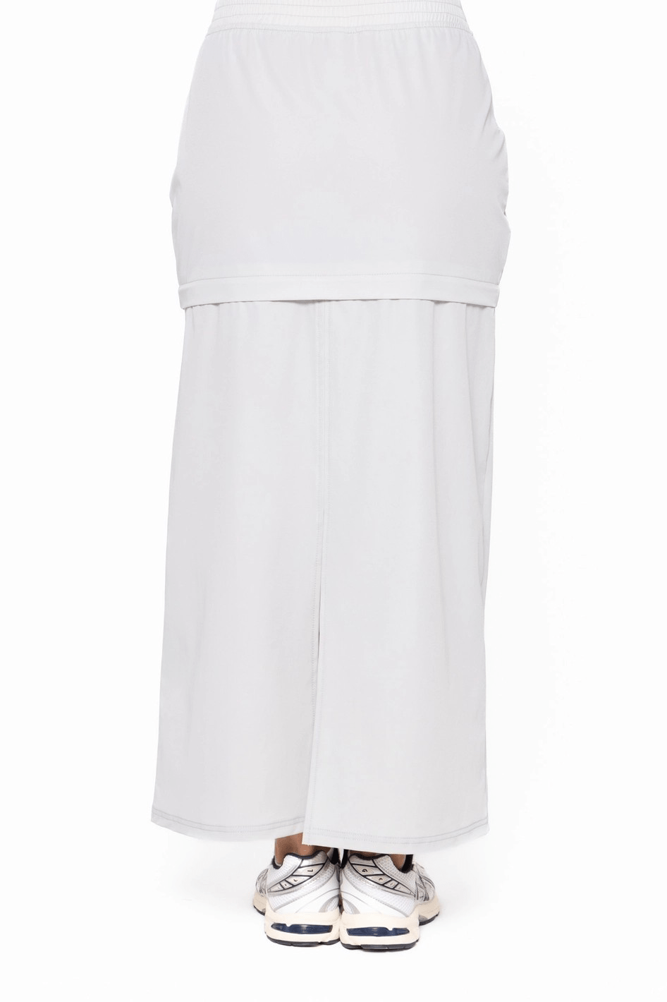 Light grey skirt and pants set on a white background